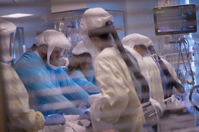 University of Utah Health workers treat patients inside the medical intensive care unit at University of Utah Hospital.