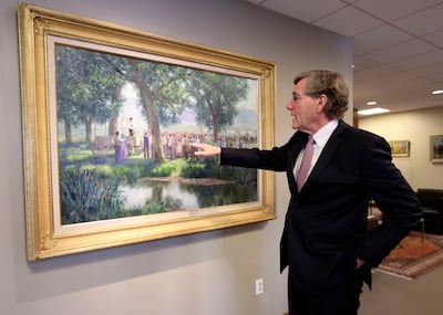 Zions Bank president and CEO Scott Anderson points out three women included in VaLoy Eaton's painting, “Prayer and Dedication of the Salt Lake Valley – Orson Pratt,” in the Zions Bank head office in Salt Lake City on Tuesday, Sept. 25, 2018.