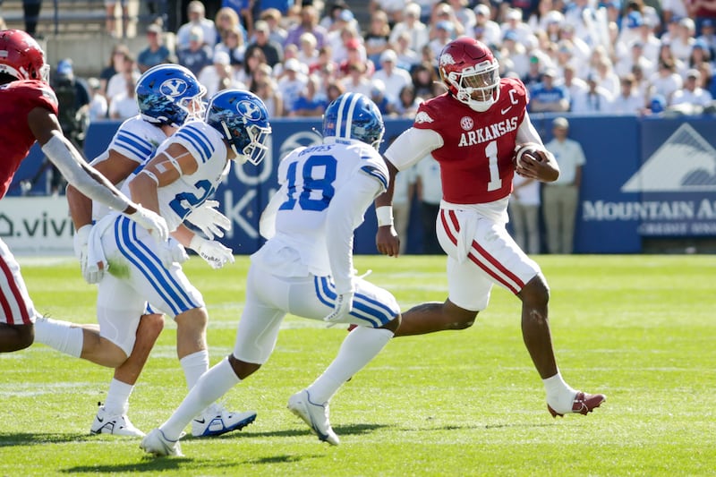 KJ Jefferson (1), the quarterback for the Arkansas Razorbacks, runs the ball while playing the BYU Cougars in Provo on Saturday, Oct. 15, 2022.
