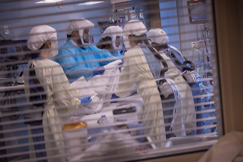 University of Utah Health workers treat patients inside the medical intensive care unit at U. Hospital in July 2021.