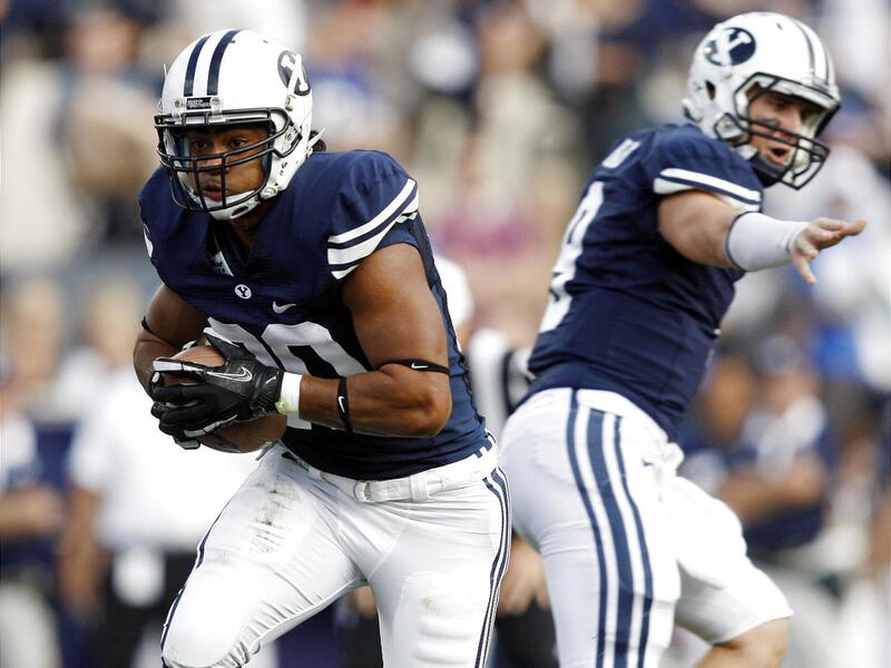 BYU's #20 Josh Quezada takes the handoff from #9 Jake Heaps as BYU and Utah State play Friday, Sept. 30, 2011 at Lavell Edwards Stadium.