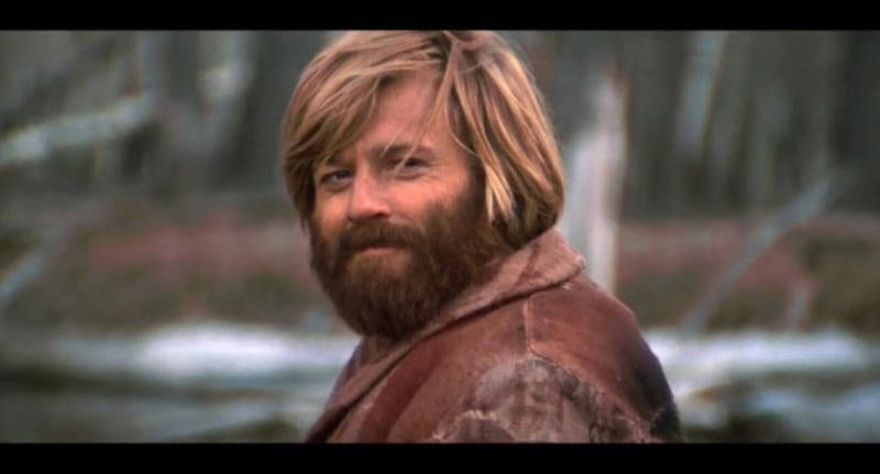 Twitter Moments just unveiled that the man in the video isn’t Zach Galifianakis, as many, including this reporter, believed it to be. The photo is identified as a scene from Robert Redford’s film “Jeremiah Johnson.”