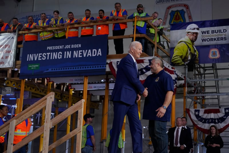 President Joe Biden arrives to speak about investment in rail projects, including high-speed trains, on Dec. 8, 2023, in Las Vegas.
