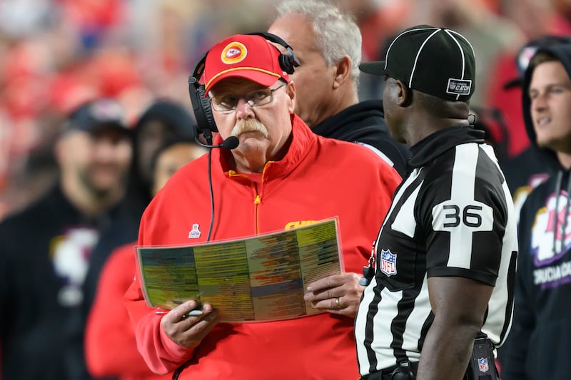 Kansas City Chiefs head coach Andy Reid, left, talks to field judge Anthony Jeffries while they wait for a replay review during game against the New Orleans Saints, Monday, Oct. 7, 2024 in Kansas City, Mo.