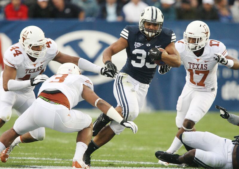 Brigham Young Cougars running back Paul Lasike (33) runs against Texas Longhorns in Provo Saturday, Sept. 7, 2013.
