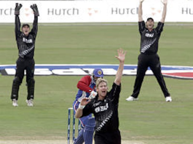 New Zealand players celebrate Friday after beating America in the first day of play in the ICC Championships Trophy event at London's Oval Stadium.