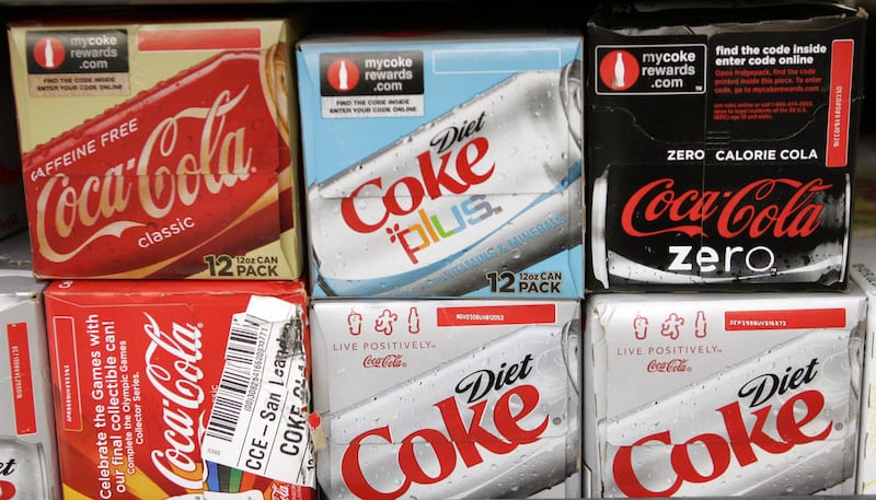 Coca Cola cans on display at a store in Palo Alto, Calif., Friday, Aug. 15, 2008. (AP Photo/Paul Sakuma)