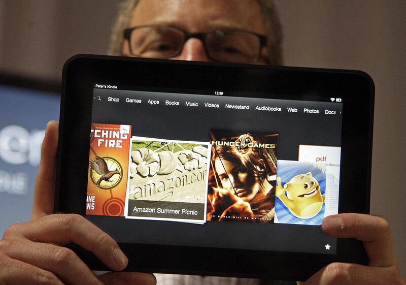 Amazon Kindle vice president Peter Larsen holds the Kindle Fire HD at the introduction of the new Kindle devices in Santa Monica, Calif., Thursday, Sept. 6, 2012.