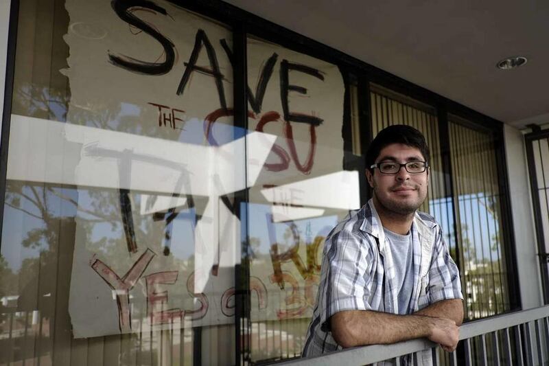In this Friday, Oct. 19, 2012 photo, graduate student Pedro Ramirez is photographed on the campus of California State University, Long Beach in Long Beach, Calif.