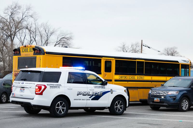 A police car and school bus on the scene of a fatal school bus crash