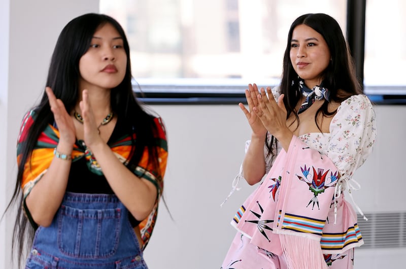 Rhianna Russell and Michelle Brown practice their walking as they rehearse for an upcoming Indigenous fashion show at the Leonardo Museum in Salt Lake City on Sunday.