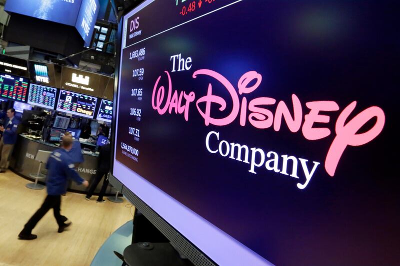 The Walt Disney Co. logo appears on a screen above the floor of the New York Stock Exchange.