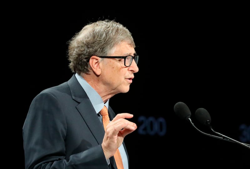 Philanthropist and co-chairman of the Bill & Melinda Gates Foundation Bill Gates gestures as he speaks to the audience during the Global Fund to Fight AIDS event.