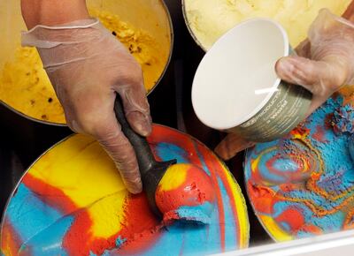 Marcus Sherwood scoops ice cream a t Farr Better Ice Cream before a Utah Jazz game on Saturday, Dec. 23, 2017.
