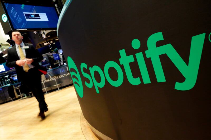 A trading post sports the Spotify logo on the floor of the New York Stock Exchange in this April 3, 2018, file photo.