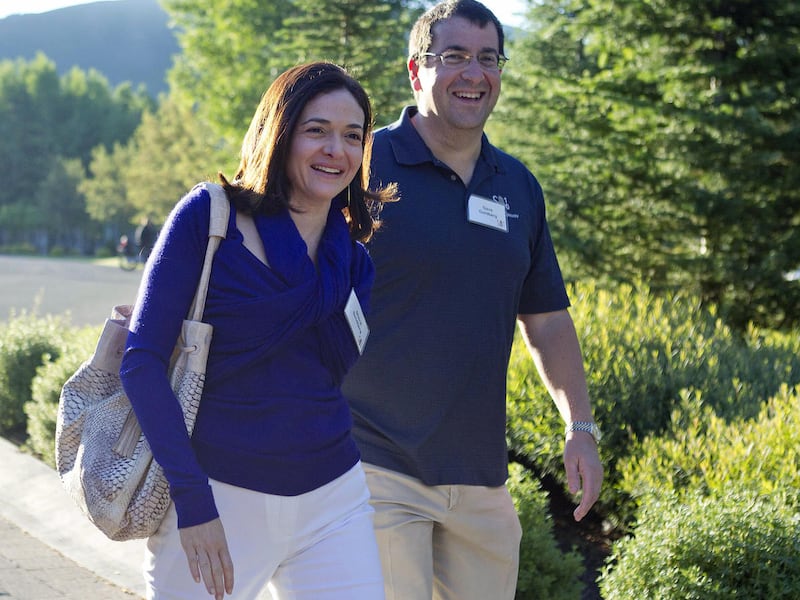 In this July 6, 2011 file photo, Facebook COO Sheryl Sandberg, left, and her husband, David Goldberg, CEO of SurveyMonkey, arrive at the Sun Valley Inn for the Allen and Co. Sun Valley Conference, in Sun Valley, Idaho. Sandberg on Wednesday, June 3, 2015