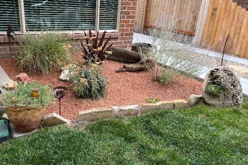 Gerrit Peterson’s yard at his home in Rose Park, where he incorporated rock beds and drought-resistant plants in addition to his small lawn.