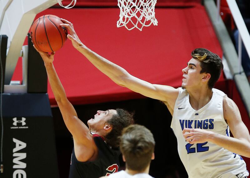 Pleasant Grove's Matt Van Komen blocks the shot by Weber's Hudson Schenck in the 6A quarterfinal game in Salt Lake City on Thursday, March 1, 2018.