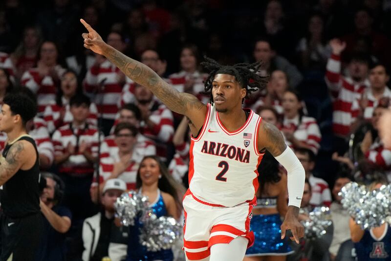 Arizona guard Caleb Love reacts after scoring against Colorado during the first half of an NCAA college basketball game.