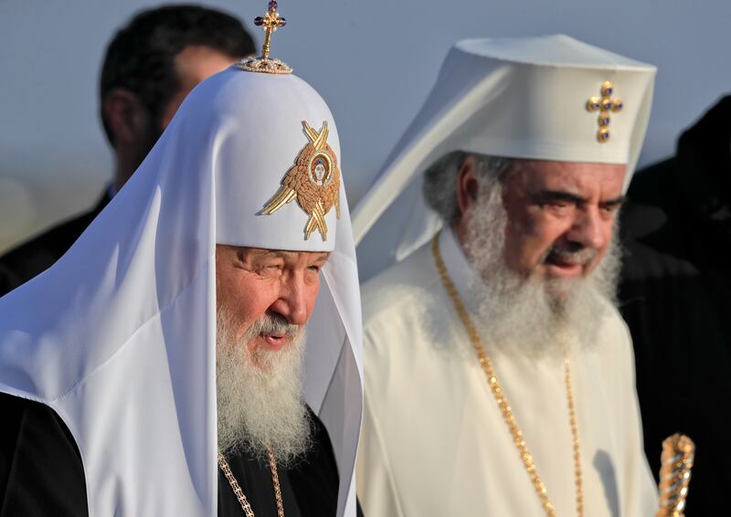 Patriarch Kirill, head of the Russian Orthodox Church, walks with Patriarch Daniel, head of the Romanian Orthodox Church.