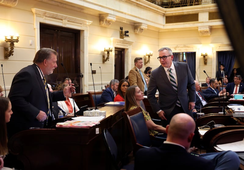 Utah lawmakers confer over a bill on transgender athletes during the last day of the 2022 legislative session.
