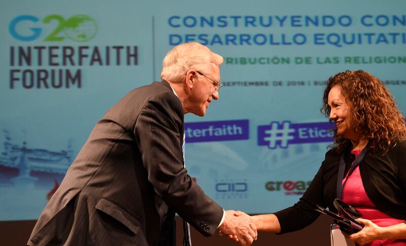 Elder D. Todd Christofferson, left, a member of the Quorum of the Twelve Apostles of The Church of Jesus Christ of Latter-day Saints, greets the Rev. Gloria Ulloa, from Colombia, on Wednesday, Sept. 26, 2018.