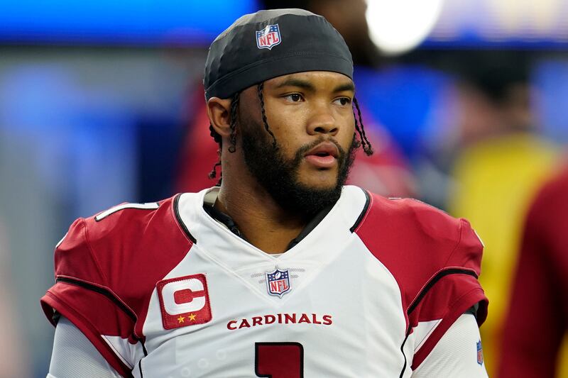 Arizona Cardinals quarterback Kyler Murray warms up before an NFL wild-card playoff football game against the Los Angeles Rams.