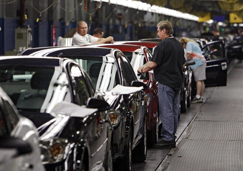 In this Tuesday, June 15, 2010, photo, workers at General Motors' Lordstown Assembly plant in Lordstown, Ohio put the final touches on Chevy Cobalts. U.S. safety regulators are demanding that General Motors turn over documents detailing what the company k