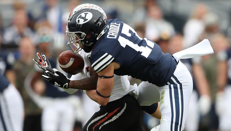 Brigham Young Cougars defensive back Matthew Criddle (17) is able to come up with an interception against Idaho State.