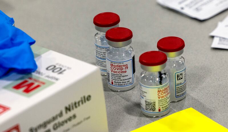 Vials of Moderna’s COVID-19 vaccines sit on a table at the Mountain America Exposition Center in Sandy on Tuesday, May 18, 2021.