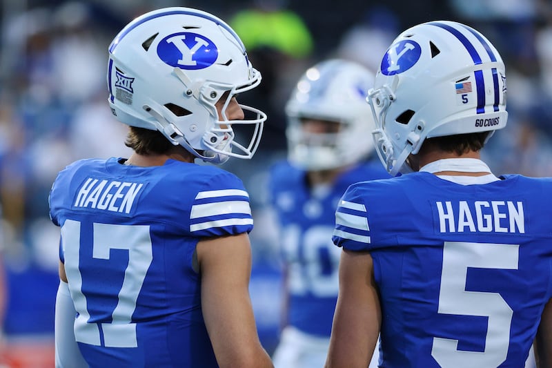 BYU quarterback Cole Hagen and BYU wide receiver Cody Hagen talk prior to a game Saturday, Sept. 6, 2025, in Provo, Utah.