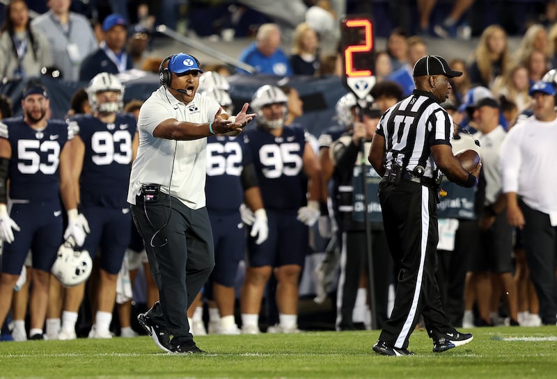 BYU coach Kalani Sitake, questions the referees after a flag was thrown against BYU and Wyoming play in Provo.