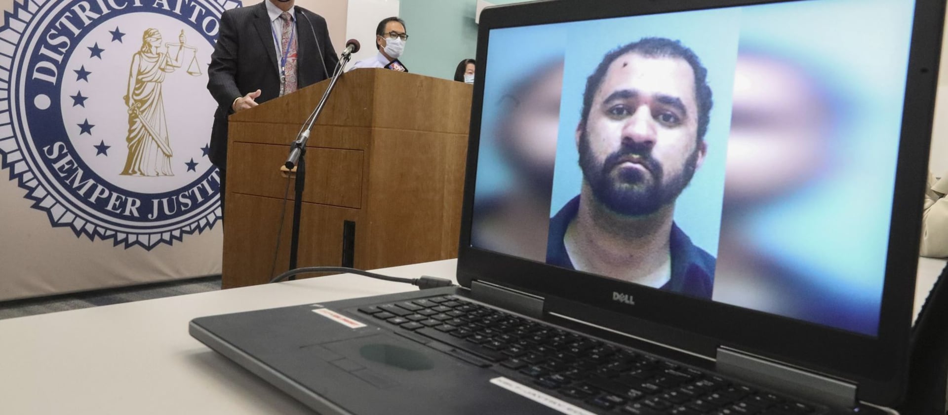 Salt Lake County District Attorney Sim Gill, left, announces aggravated murder charges against Adam Antonio Spencer Durborow.