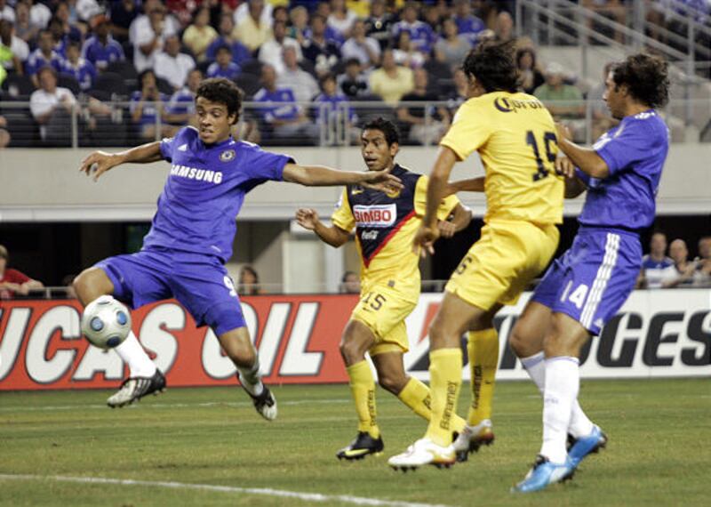 Chelsea FC's Franco Di Santo, left, shoots and scores as, from left, Club America's Guillermo Cerda and Rodirigo Inigo and Chelsea FC's Claudio Pizarro watch in the second half of the World Football Challenge soccer match at Cowboys Stadium, Sunday, in Ar