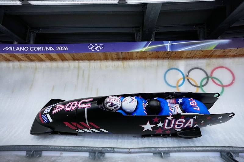 United States' Kristopher Horn, left, Caleb Furnell, right, Hunter Powell and Carsten Vissering slide down the track during a four-man bobsled run at the 2026 Winter Olympics in Cortina d'Ampezzo, Italy, on Saturday, Feb. 21, 2026.