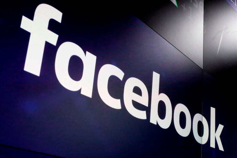 The logo for Facebook appears on screens at the Nasdaq MarketSite in New York’s Times Square.
