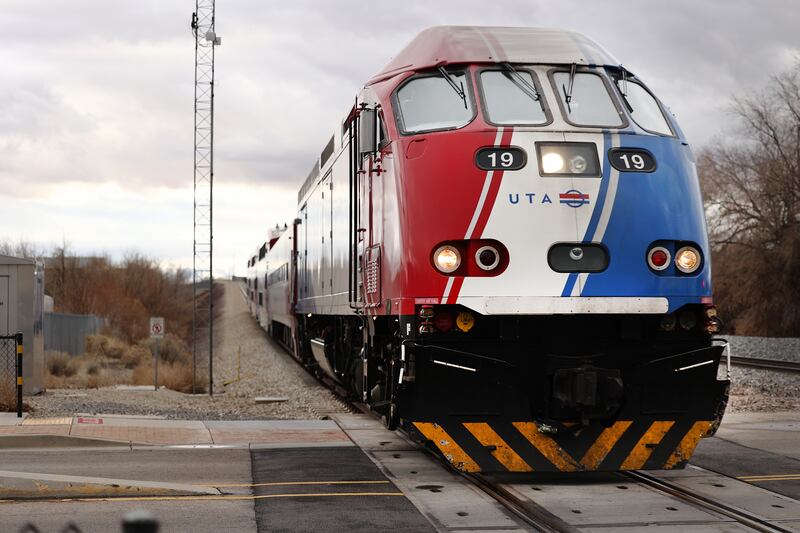 A front view of a Utah FrontRunner train on the tracks.