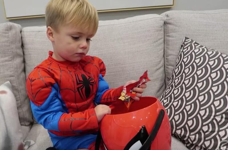 Jackson Mecham (2) stares glumly into his empty candy bucket.