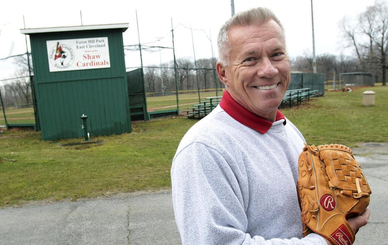 In this April 4, 2011 photo, Buddy Schultz, a graduate of Shaw High School in 1968, stands by the Shaw High School baseball field in Forest Hills Park in East Cleveland, Ohio. Schultz's pitching talents led him from a high school state championship team t