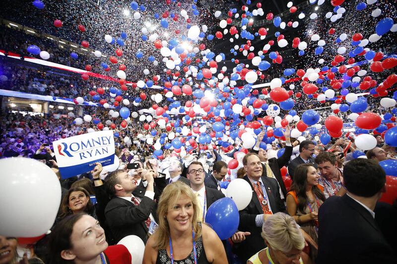 Balloons fall as Republican presidential nominee Mitt Romney and Republican vice presidential nominee, Rep. Paul Ryan's families take the stage at the Republican National Convention in Tampa, Fla., on Thursday, Aug. 30, 2012.