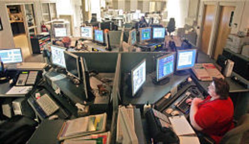 Doris Mohler, right, leads dispatcher team at Utah County Sheriff's Office. Mandatory overtime is in effect.