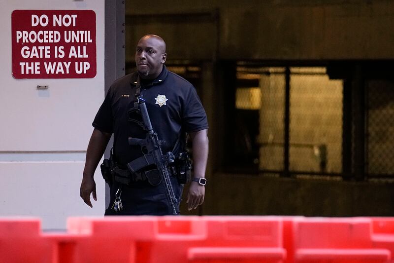 A police officer stands outside the Fulton County Courthouse in Atlanta.