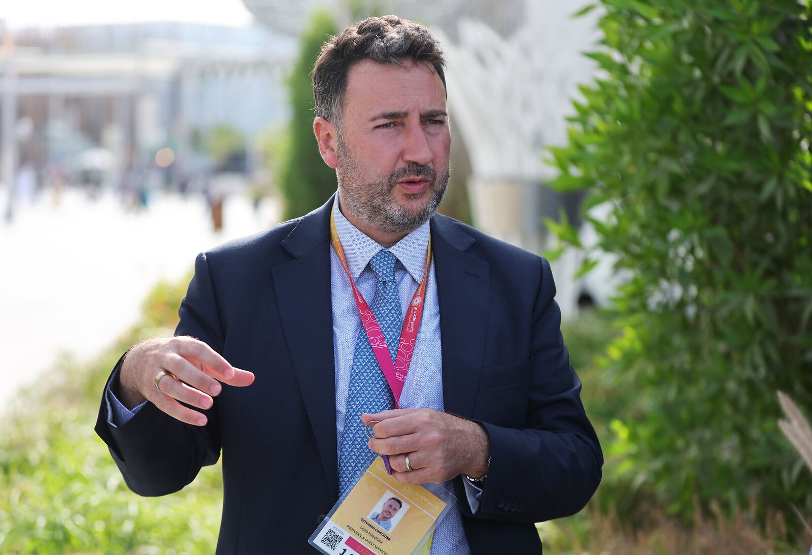 Giovanni Criscione, World Expo senior protocol director, gives a tour during the Expo 2020 Dubai in Dubai, United Arab Emirates, on Sunday, March 27, 2022. The 2020 event was delayed for two years.