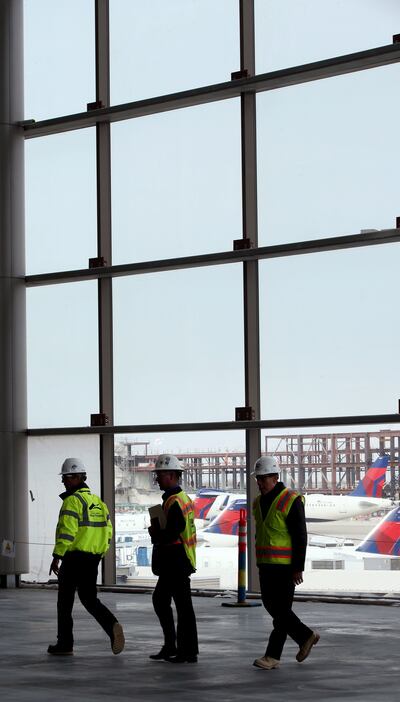 People tour a plaza in one of the concourses being built at the Salt Lake City International Airport on Wednesday, Feb. 20, 2019.