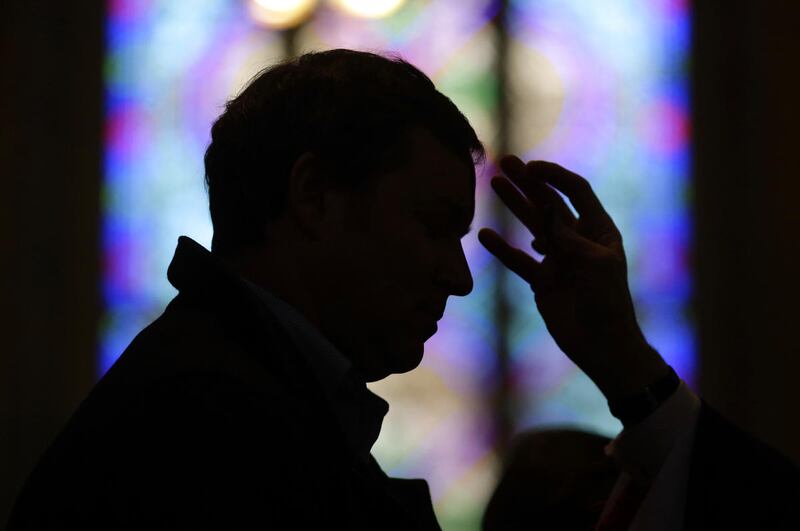 A man receives ashes from Baltimore Archbishop William Lori during an Ash Wednesday Mass, Wednesday, Feb. 18, 2015, in Baltimore, Maryland. Ash Wednesday marks the start of the Lent, a season of prayer and fasting for Christians before Easter.