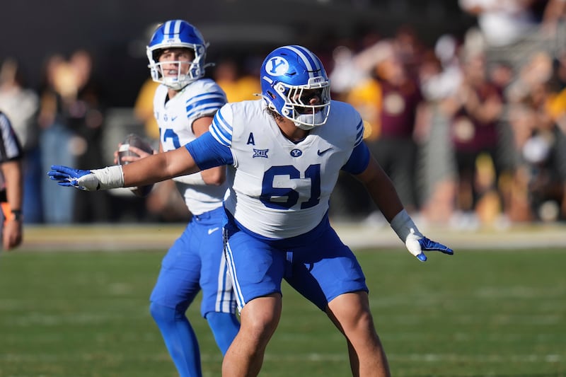 BYU offensive lineman Weylin Lapuaho (61) looks to make a block during game against Arizona State Saturday, Nov. 23, 2024, in Tempe, Ariz.