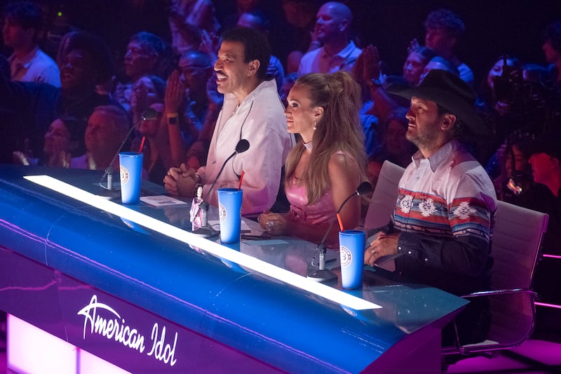 Lionel Richie, Carrie Underwood and Luke Bryan sit at the judges' table during an episode of "American Idol."