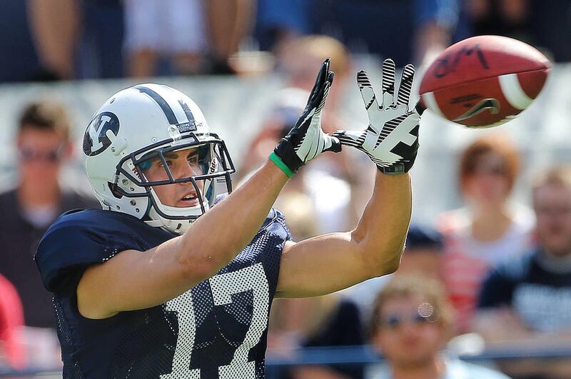 Skyler Ridley makes a catch as the BYU football team practices and scrimmages on Aug. 10 at Lavell Edwards Stadium.