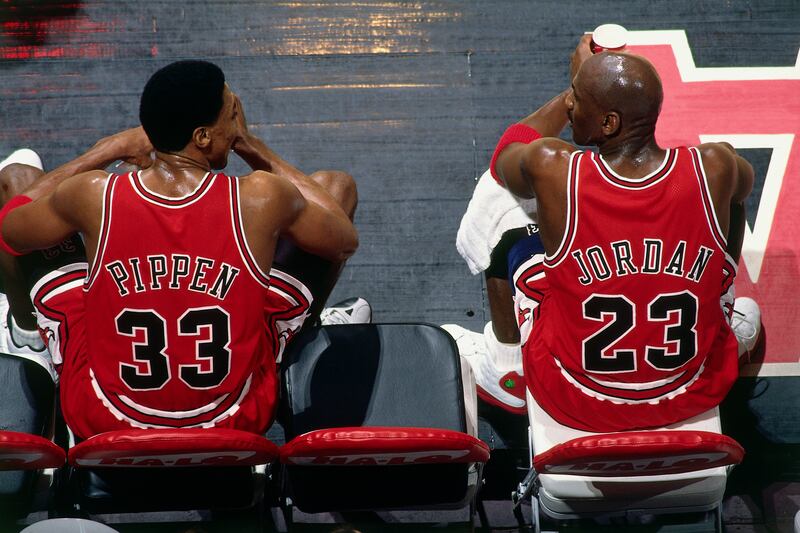 VANCOUVER, BC - JANUARY 27: Scottie Pippen #33 and Michael Jordan #23 of the Chicago Bulls sit on the bench during the game against the Vancouver Grizzlies at General Motors Place on January 27, 1998 in Vancouver, British Columbia, Canada.