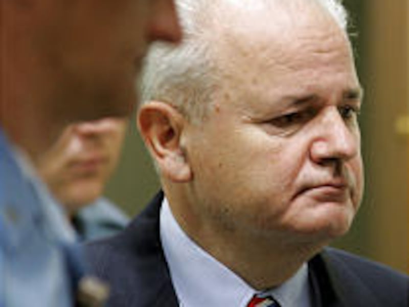 Former Yugoslav President Slobodan Milosevic accused enemies of conspiracies at start of war crimes trial Tuesday.